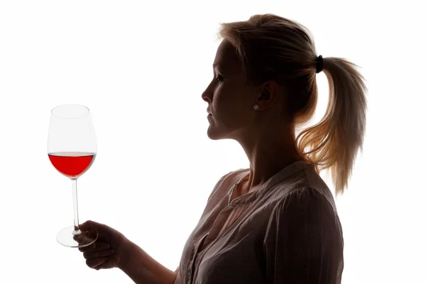 Kvinde med rødvin i vinglas - Stock-foto