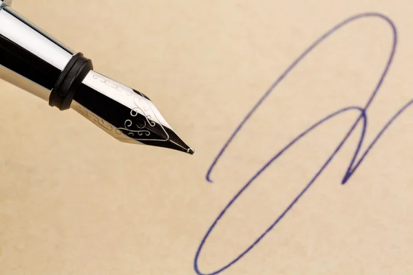 Signature and fountain pen — Stock Photo, Image