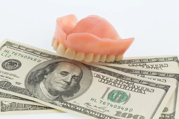 Teeth and dollar bills — Stock Photo, Image