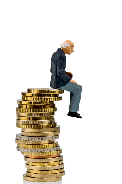 Pensioners sitting on a pile of money — Stock Photo, Image