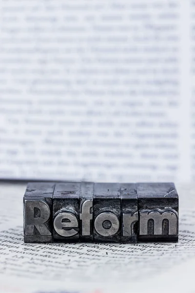 Reforma escrita em letras de chumbo — Fotografia de Stock