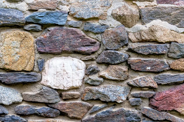 Murverk färgade naturliga stenar — Stockfoto