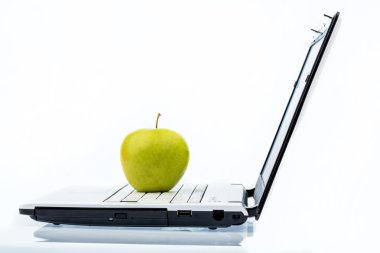 apple lying on a keyboard clipart