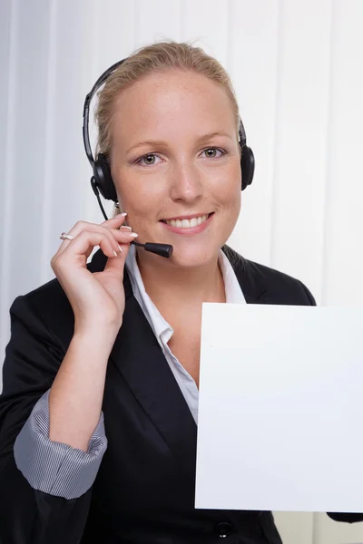 Friendly woman with headset in customer service — Stock Photo, Image