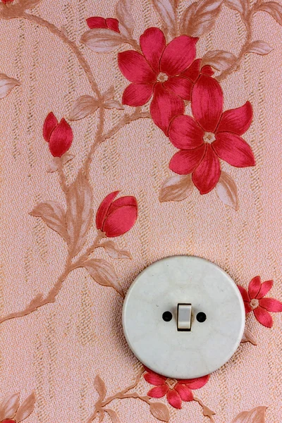 Old wallpaper with light switch — Stock Photo, Image