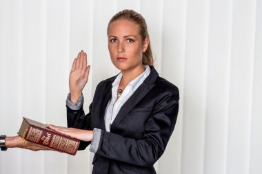 woman swears on the bible clipart