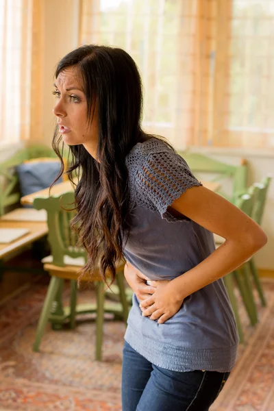 Woman has abdominal pain — Stock Photo, Image