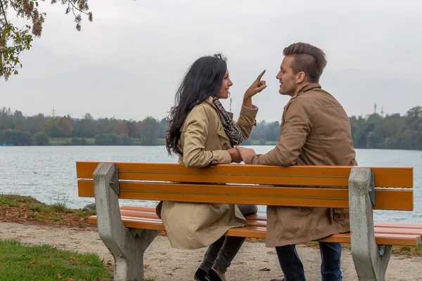 Loving couple on a park bench — Stock Photo, Image