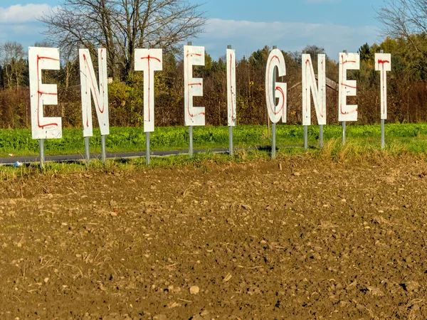 Expropriates lettering on a field — Stock Photo, Image