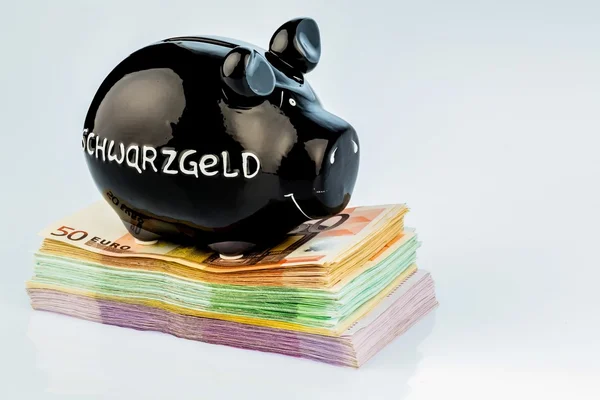 Black piggy bank on money — Stock Photo, Image