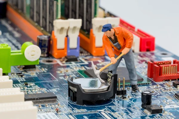 Computer board and construction workers — Stock Photo, Image
