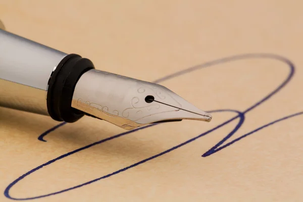 Signature and a fountain pen — Stock Photo, Image