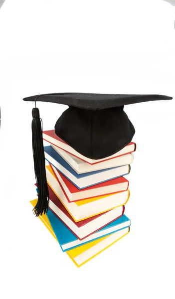 Mortar board on books stack — Stock Photo, Image