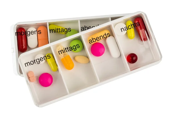 Tablettenspender und Tabletten — Stockfoto