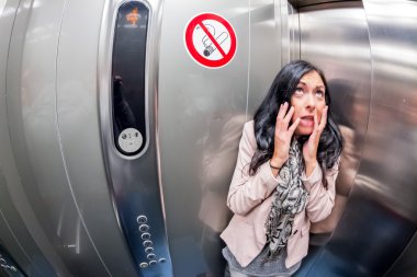 woman with claustrophobia in elevator clipart