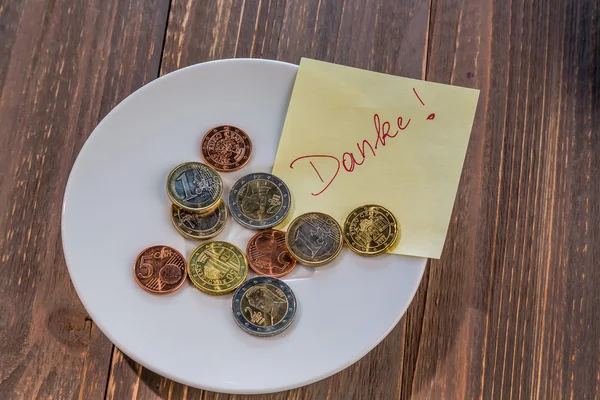 Plate with coins — Stock Photo, Image