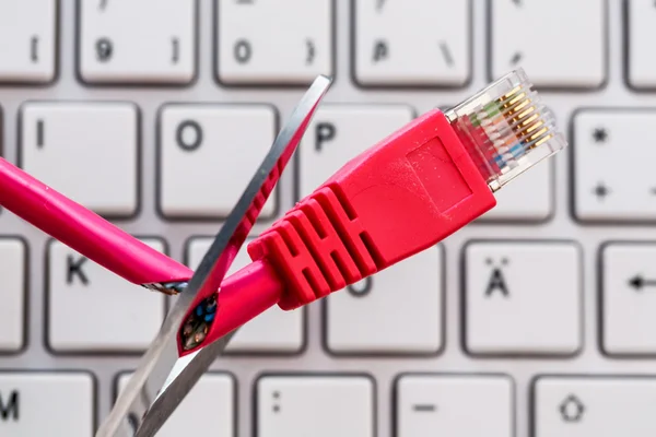 Defective network cable on keyboard — Stock Photo, Image