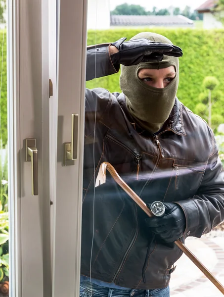 Burglar at a window — Stock Photo, Image