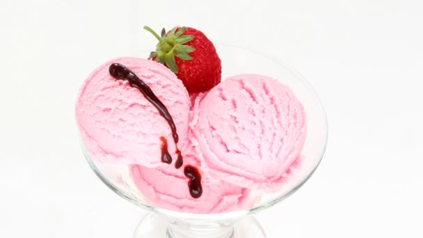 Strawberry ice cream pours  liquid chocolate ball — Stock Video