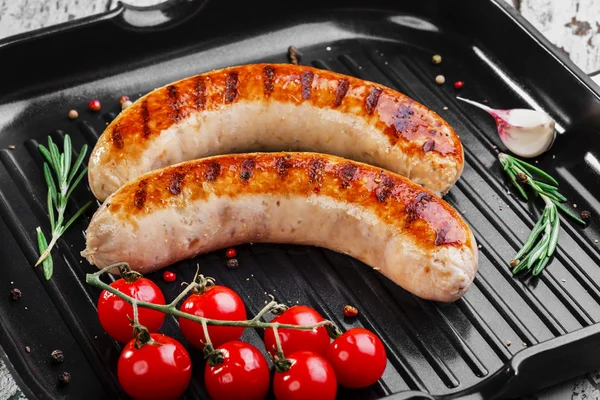 Chicken sausages on a grill pan — Stock Photo, Image