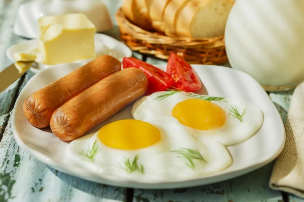 Fried eggs with sausages — Stock Photo, Image