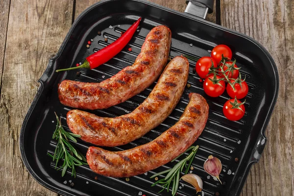 Grilled sausages in a pan — Stock Photo, Image