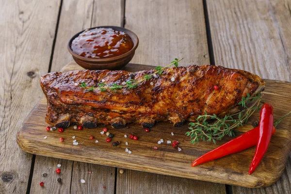 Baked pork ribs on the board — Stock Photo, Image