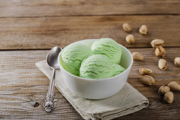 Pistachio ice cream in a bowl the ball — Stock Photo, Image