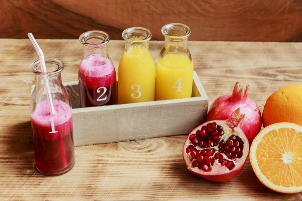 Fresh pomegranate juice and orange squeeze — Stock Photo, Image