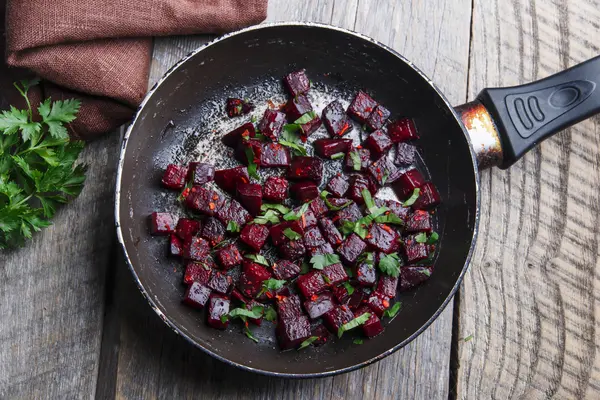 Cooked beets sliced and fried in a pan — Stock Photo, Image