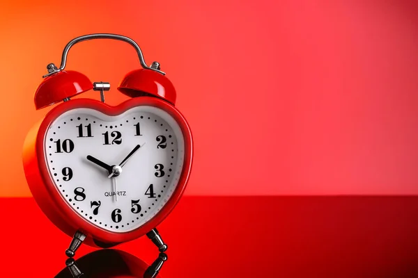 Red alarm clock in the shape of a heart. — Stock Photo, Image