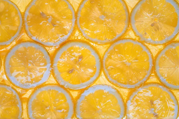 Fatias Limão Fresco Amarelo Debaixo Água Como Fundo Texturizado — Fotografia de Stock