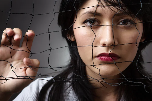 Behind a fishing net — Stock Photo, Image