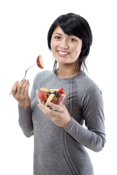 Modèle fitness avec salade de fruits — Photo