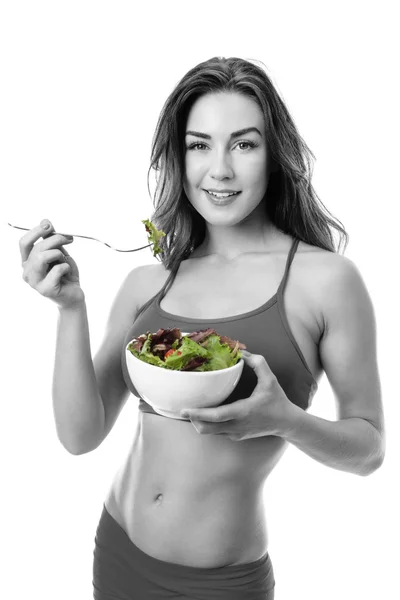 Healthy young woman eating green salad — Stock Photo, Image