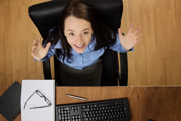 Woman working at desk shot from above — Stock Photo, Image