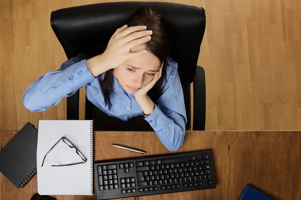 Woman working at desk shot from above — Stock Photo, Image