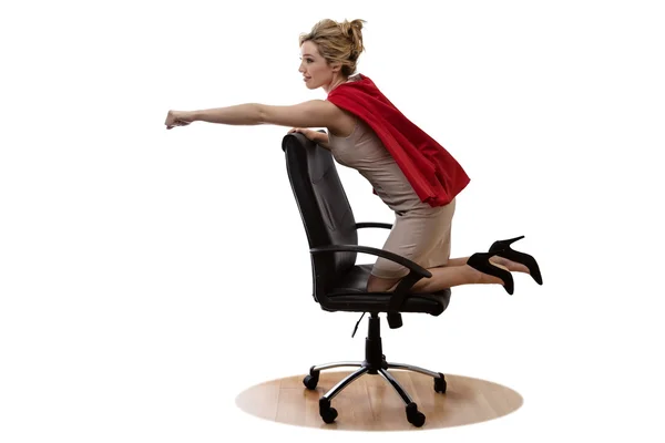 Business superhjälte på en stol — Stockfoto