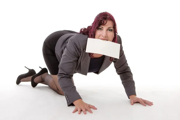 Woman crawling with card in her mouth — Stock Photo, Image