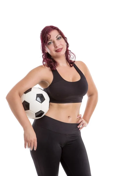 Sexy ženské postavení a držení míče — Stock fotografie
