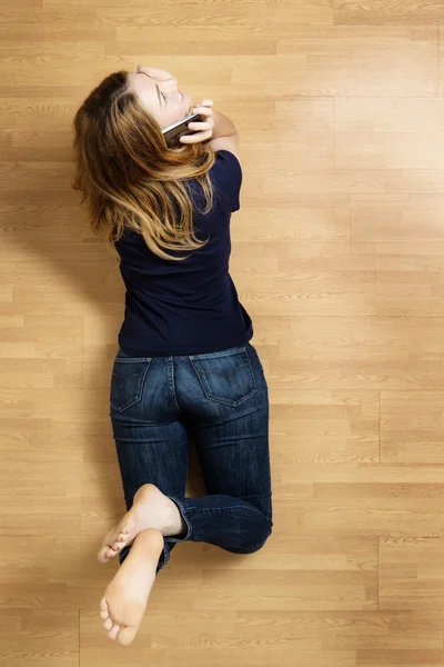 Woman on wooden floor — Stock Photo, Image