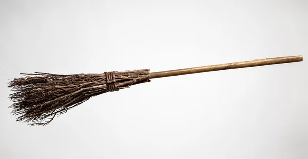 Old broomstick cut out — Stock Photo, Image