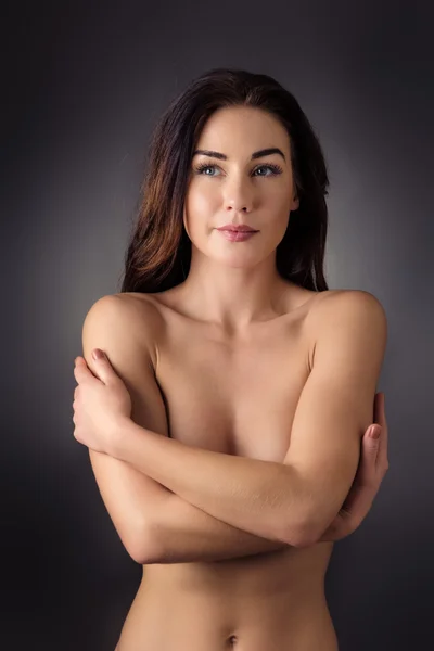 Nude woman covering her breast — Stock Photo, Image