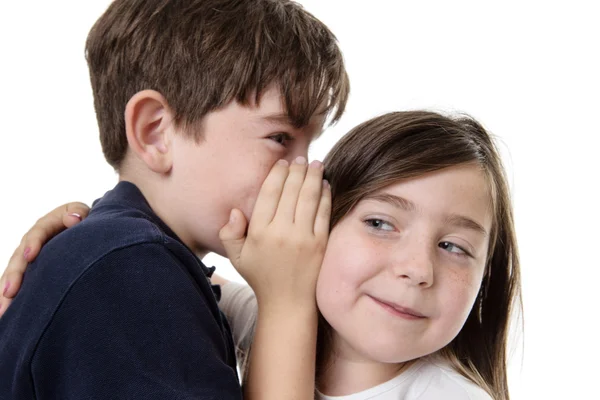 Niños compartiendo un secreto — Foto de Stock