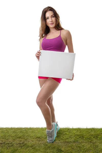 Fitness vrouw met lege blanco papier teken. — Stockfoto