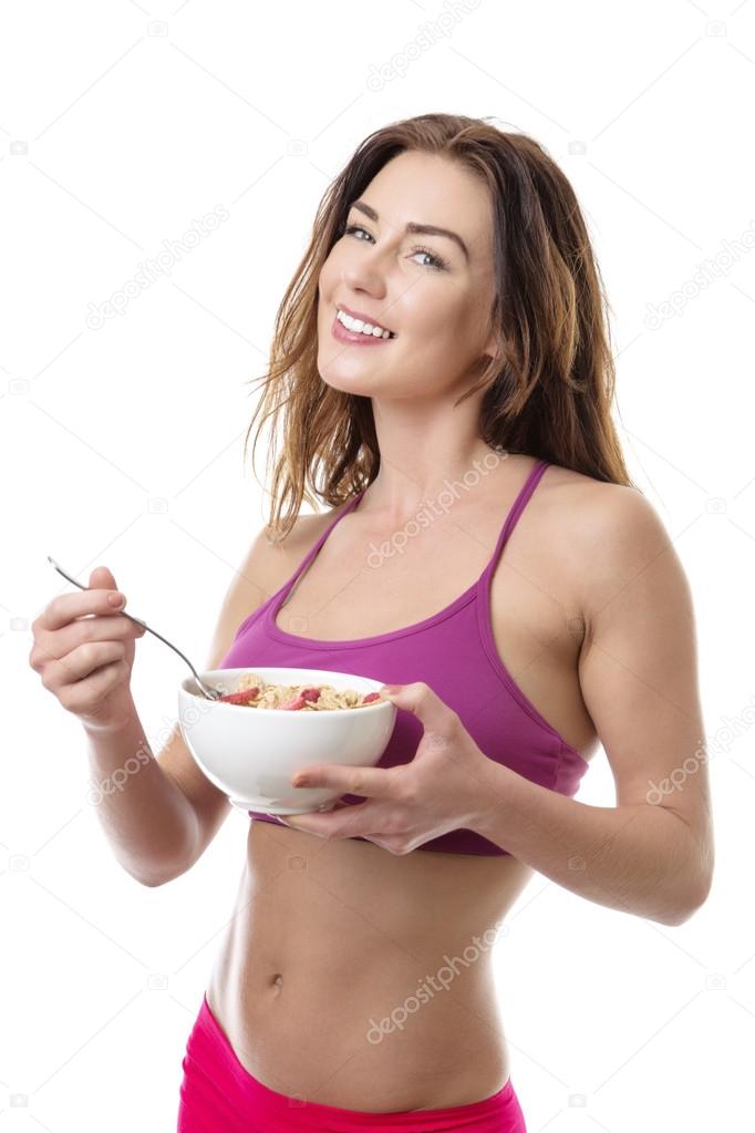 Beautiful brunette eating cereal