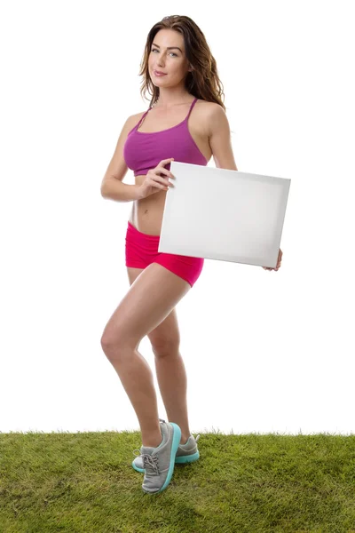 Fitness vrouw met lege blanco papier teken. — Stockfoto