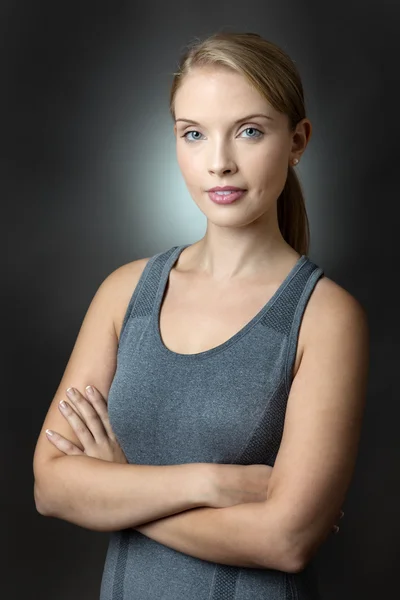 Fitness model with arms crossed — Stock Photo, Image