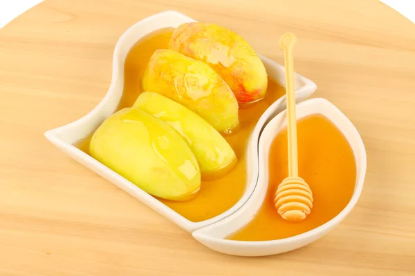 Dipping apples in honey — Stock Photo, Image