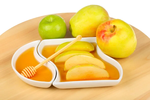 Manzanas y rodajas de manzana en miel —  Fotos de Stock